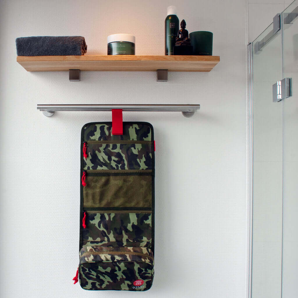 Toiletry bag to roll out and hang in tent or bathroom