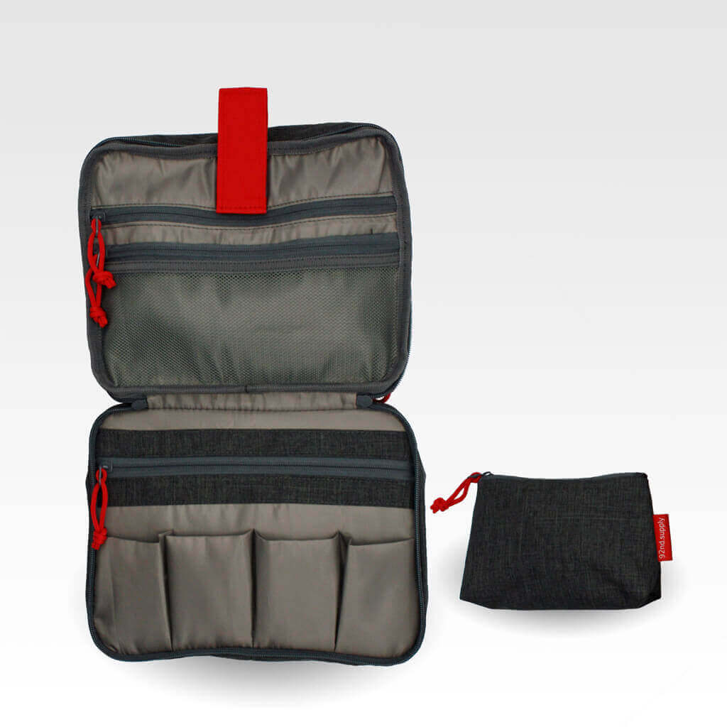 Toiletry bag with lipstick bag gray, folded for organized packing.