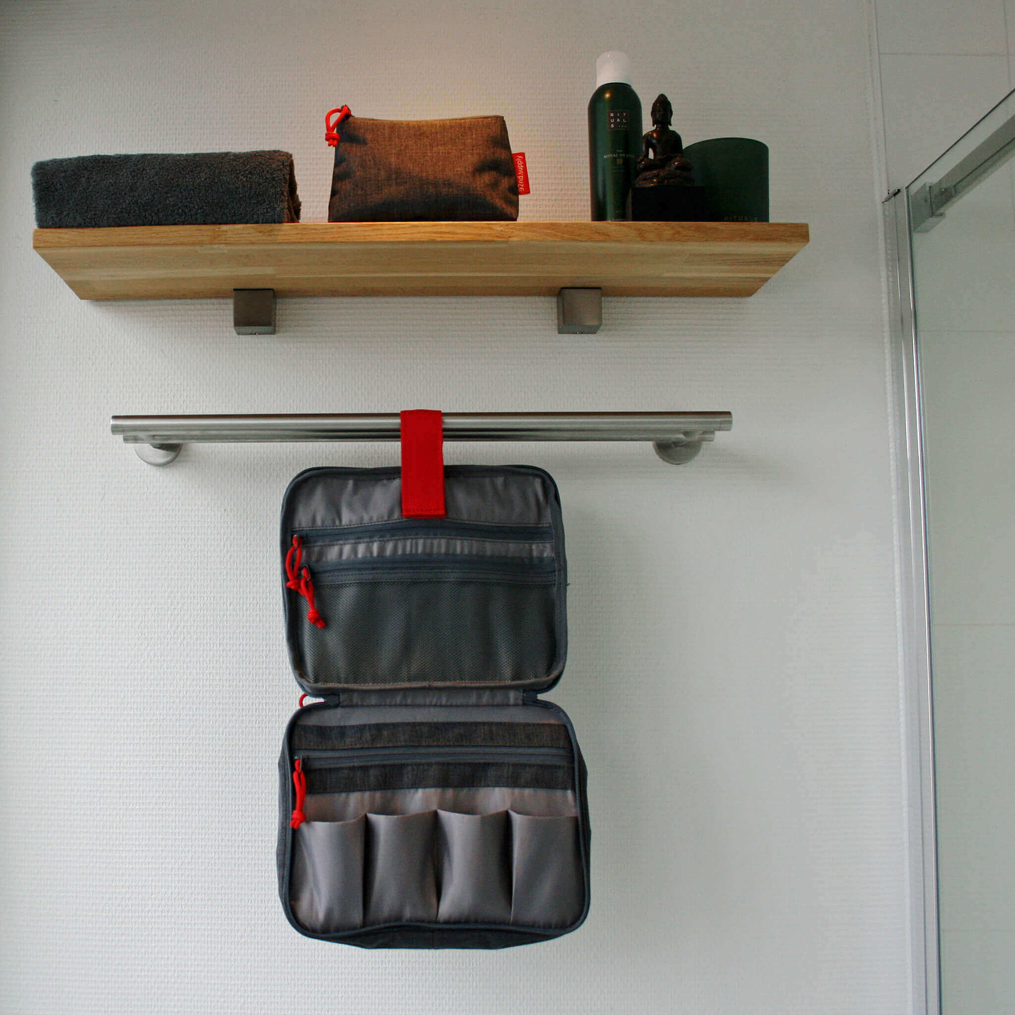 Gray toiletry bag with makeup pouch. Hang on a rod or hook.