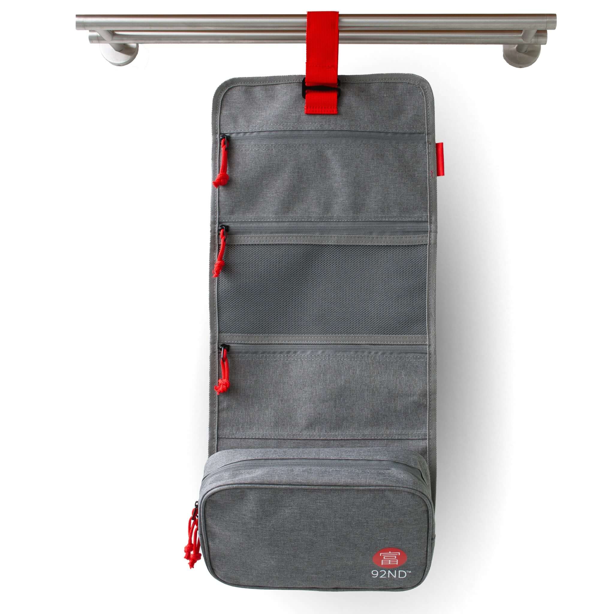 Hanging toiletry bag Washroll grey – hanging organiser with multiple compartments and red accents.
