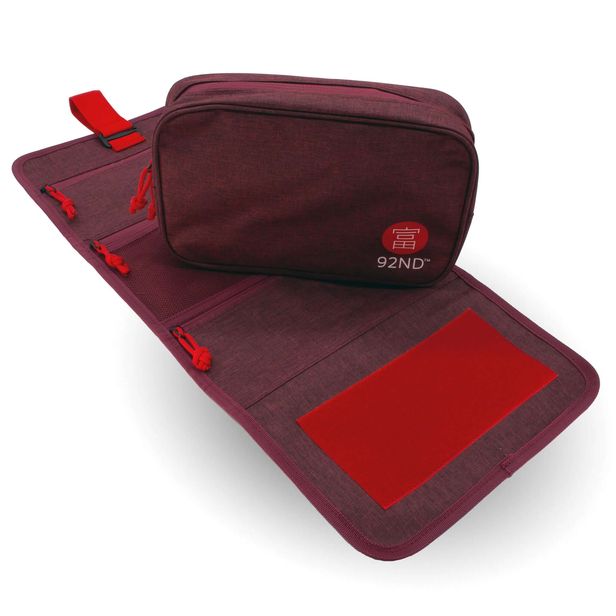 Hanging Toiletry Bag Washroll red, rolled out with handy zippers and compartments.